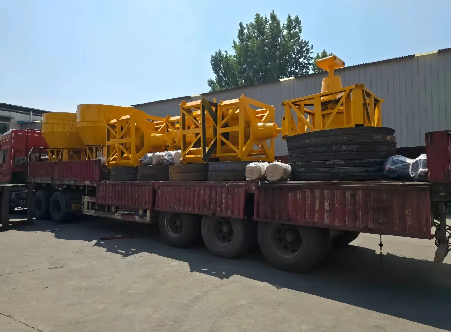 Wet pan mills loaded on a truck for export transport